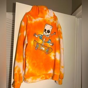 A Simpsons orange tie-dye hoodie.